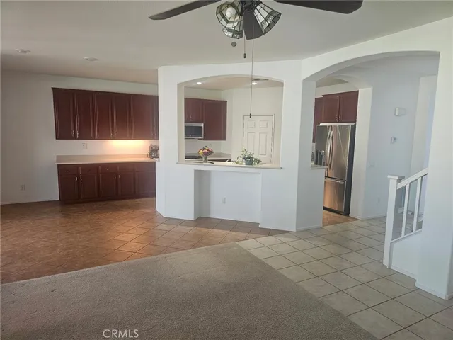 a kitchen with stainless steel appliances a refrigerator and a sink