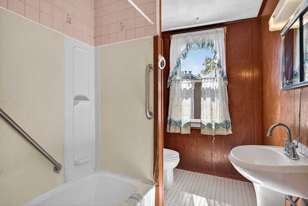 14 Wall Street Boston, MA 02129 - Photo 8 of 18 a bathroom with a sink a mirror and a bathtub
