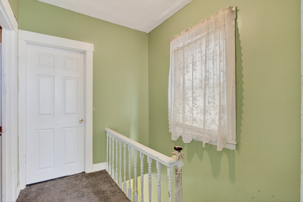 14 Wall Street Boston, MA 02129 - Photo 10 of 18 a view of a hallway with a window