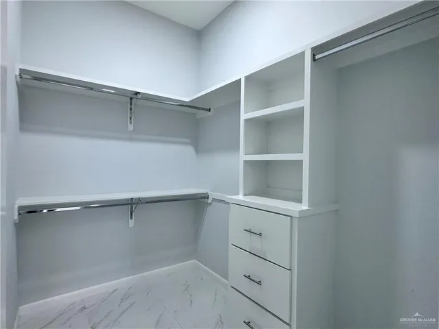 a view of an empty walk in closet
