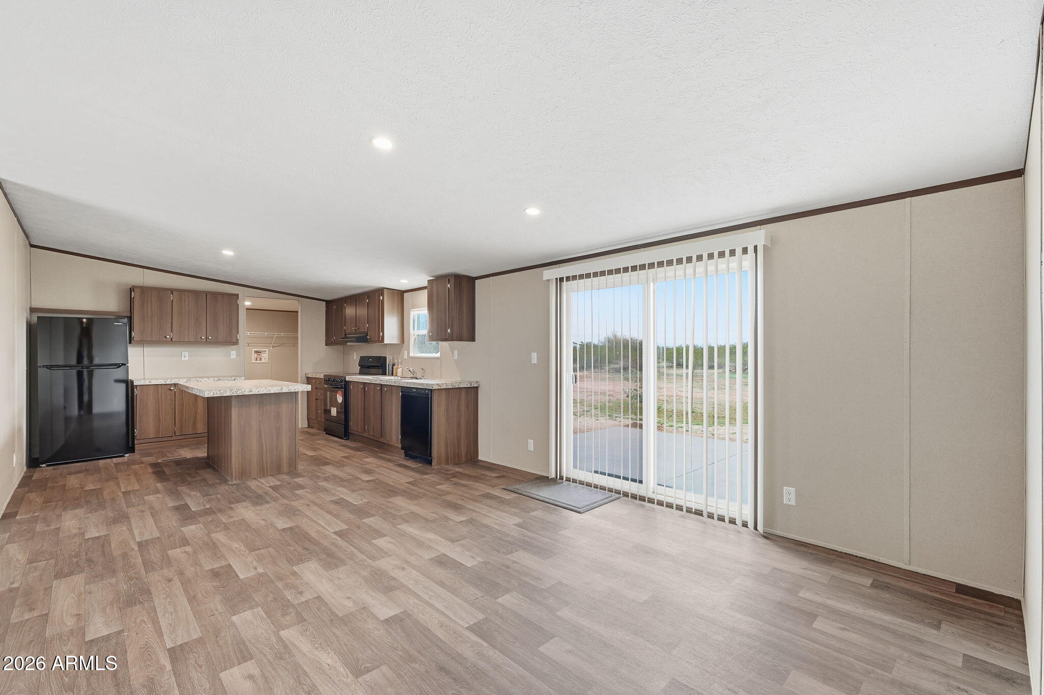 10567 North Dogwood Road Florence, AZ 85132 - Photo 5 of 28 a view of a kitchen with a sink and a large window