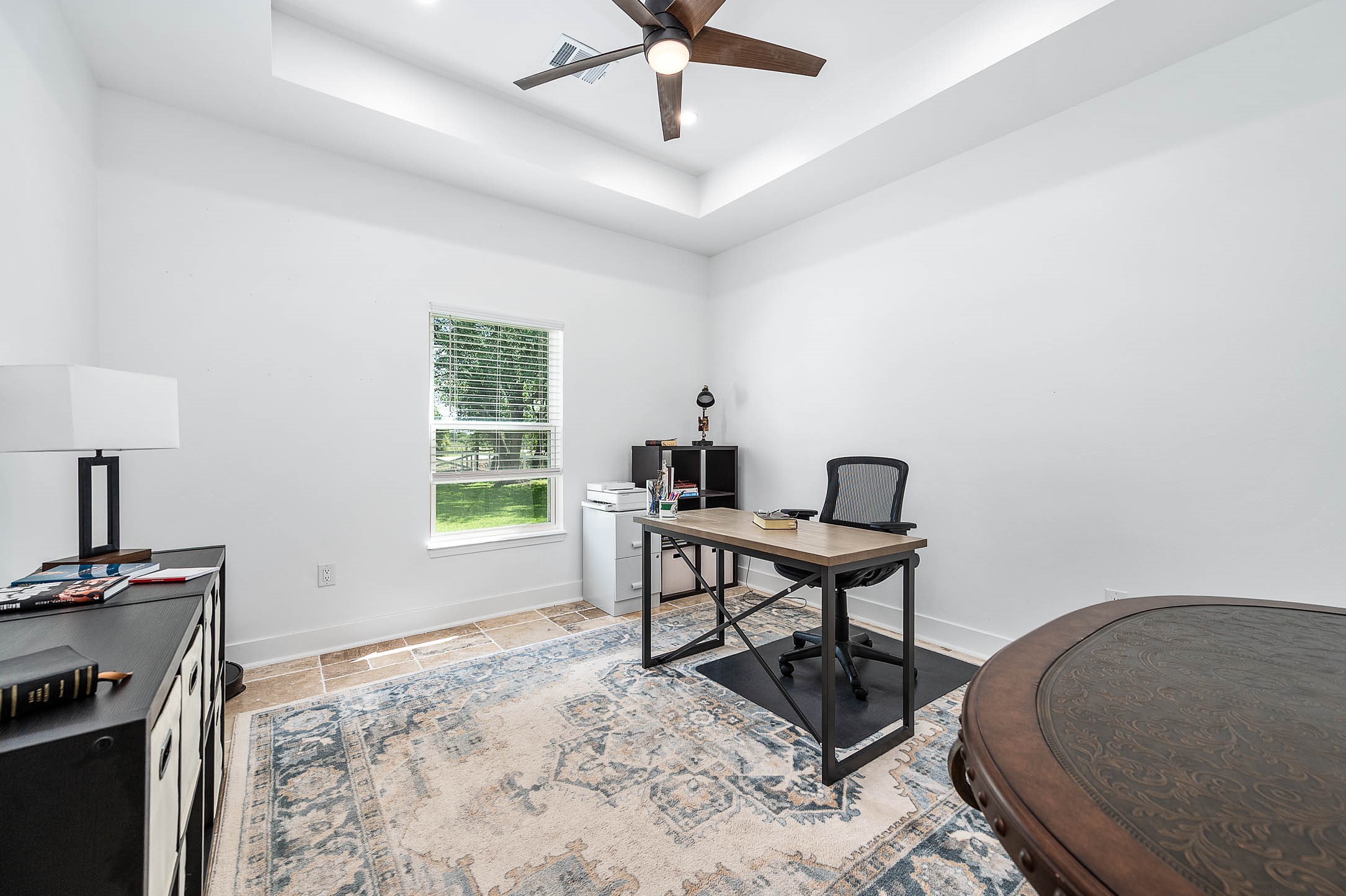 8032 Short Road Needville, TX 77461 - Photo 24 of 50 The third bedroom offers a bright and versatile space with large windows that bring in natural light and a layout that easily adapts to your needs. Currently used as a home office, this room would also make an excellent guest room, nursery, or additional bedroom.