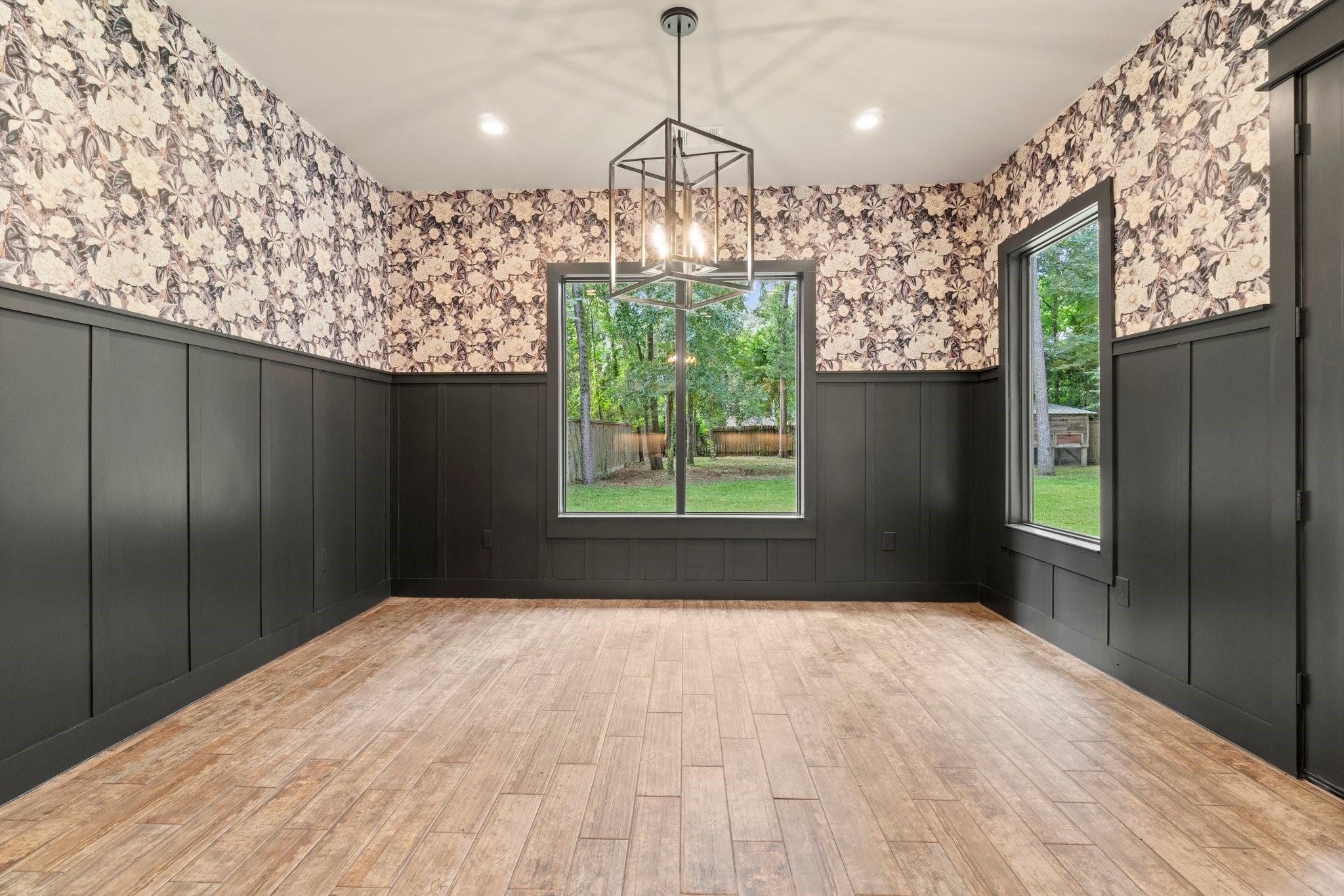 2402 Chantilly Lane Conroe, TX 77384 - Photo 13 of 49 a view of a room with a chandelier and wooden floor