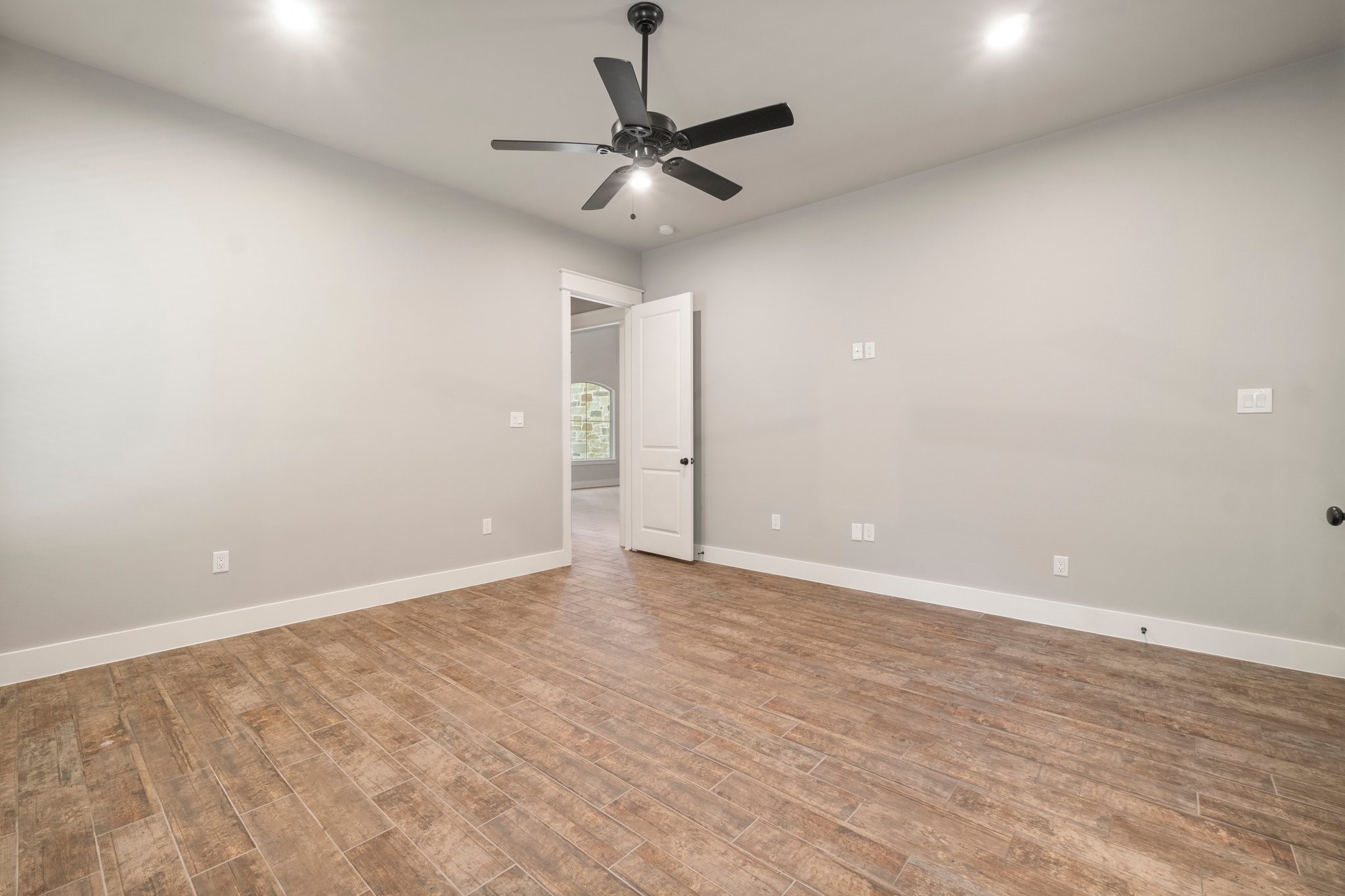 2402 Chantilly Lane Conroe, TX 77384 - Photo 17 of 49 wooden floor in an empty room
