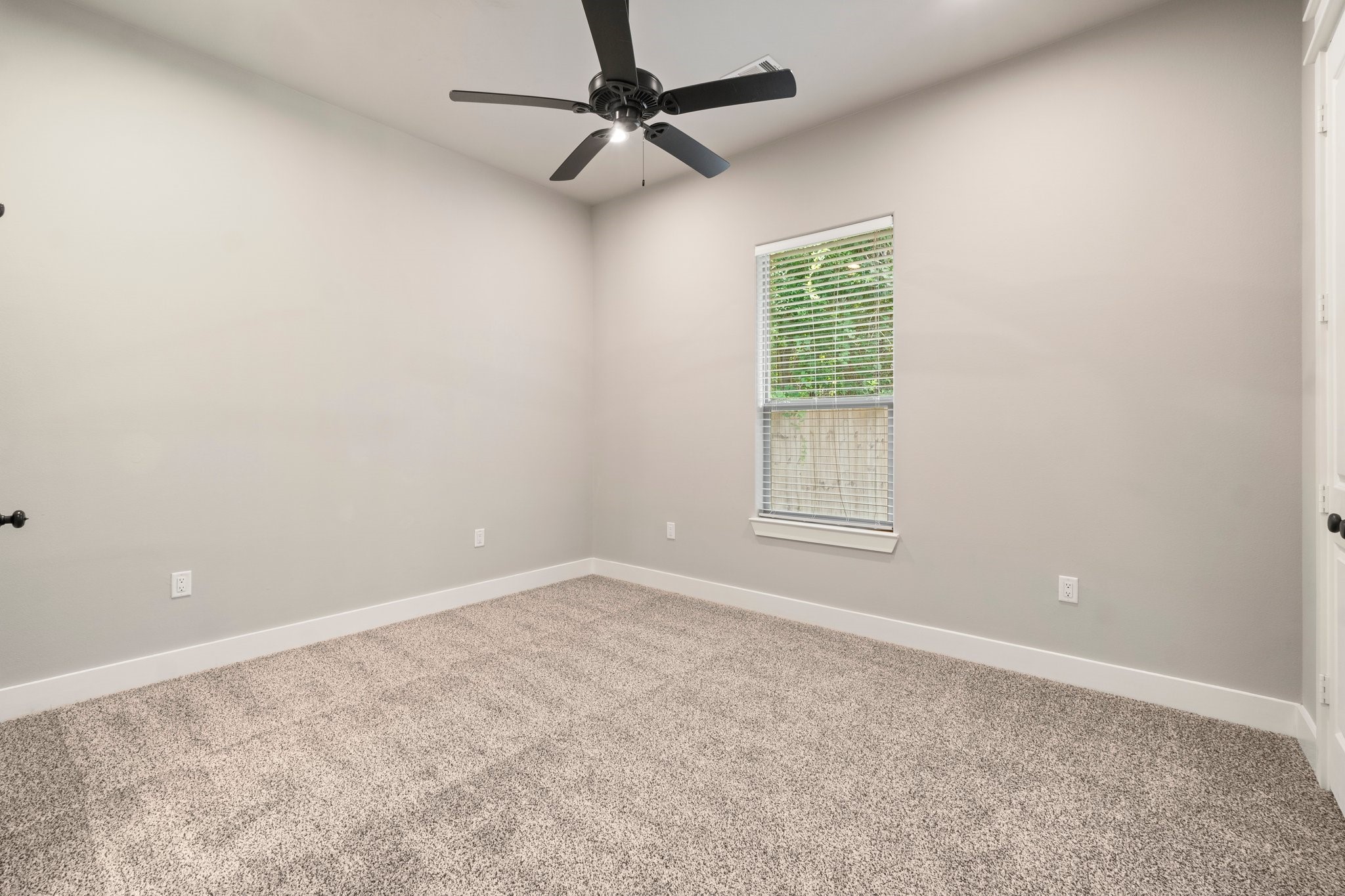 2402 Chantilly Lane Conroe, TX 77384 - Photo 29 of 49 a view of an empty room with a window