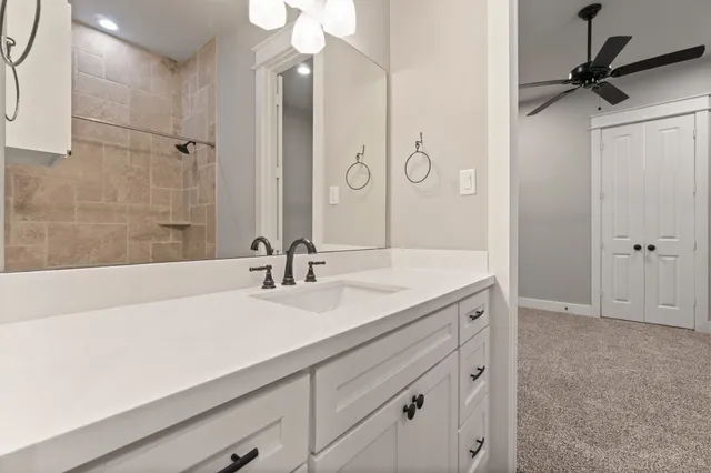 a bathroom with a sink a vanity and a mirror