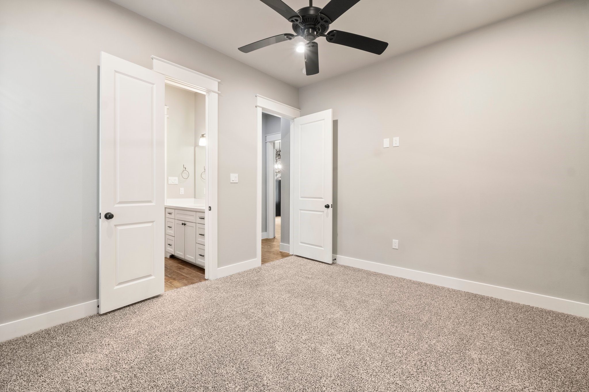 2402 Chantilly Lane Conroe, TX 77384 - Photo 32 of 49 an empty room with closet and a ceiling fan