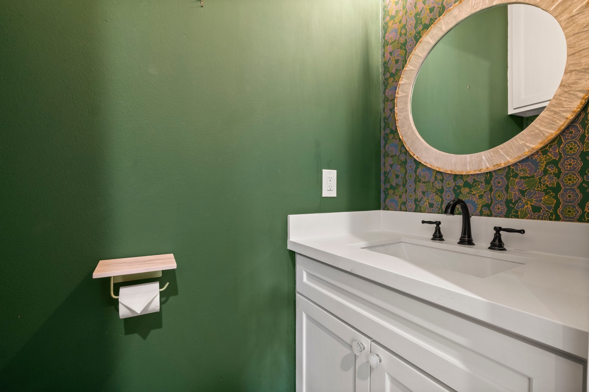 2402 Chantilly Lane Conroe, TX 77384 - Photo 36 of 49 a bathroom with a sink and a mirror