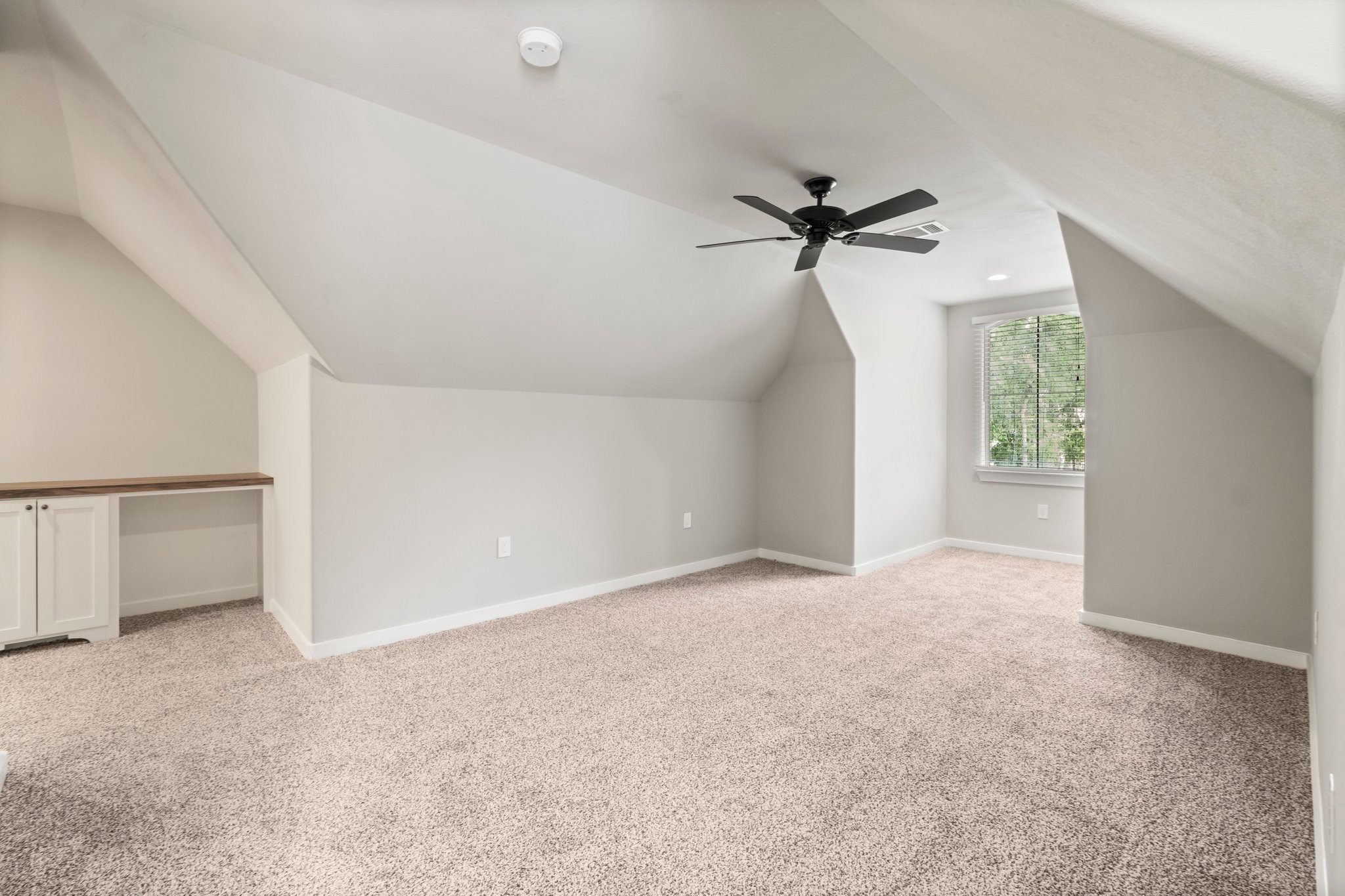 2402 Chantilly Lane Conroe, TX 77384 - Photo 38 of 49 a view of an empty room with a window