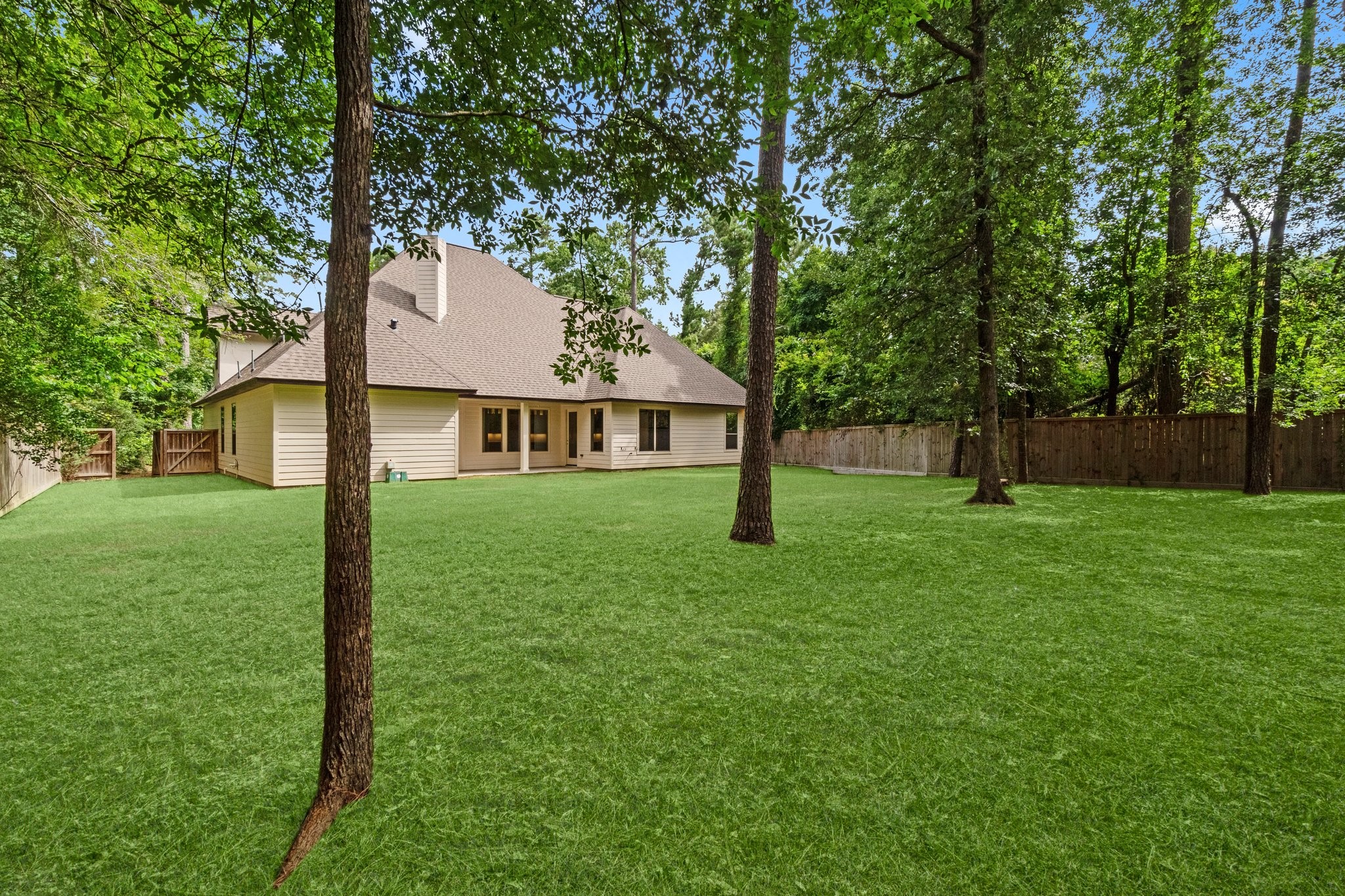 2402 Chantilly Lane Conroe, TX 77384 - Photo 49 of 49 front view of a house with a yard
