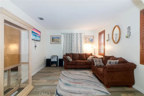 a kitchen with stainless steel appliances granite countertop a sink counter space cabinets and a large window