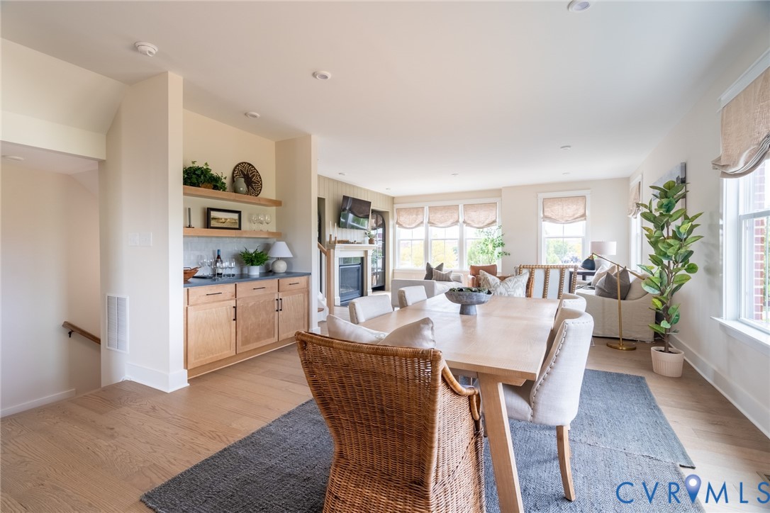 319 Golden Haze Alley, Unit 111 Midlothian, VA 23113 - Photo 11 of 39 a view of a dining room with furniture