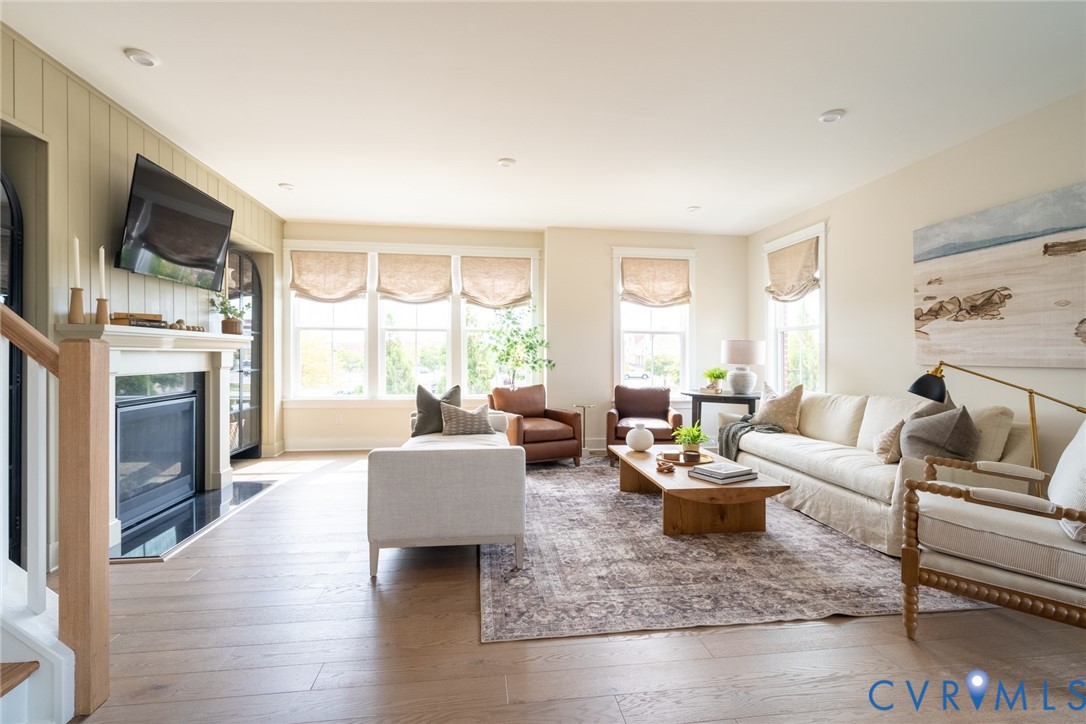 319 Golden Haze Alley, Unit 111 Midlothian, VA 23113 - Photo 17 of 39 a living room with furniture fireplace and a window