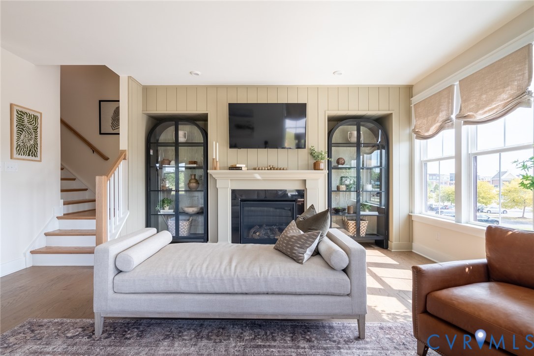 319 Golden Haze Alley, Unit 111 Midlothian, VA 23113 - Photo 18 of 39 a living room with furniture fireplace and flat screen tv