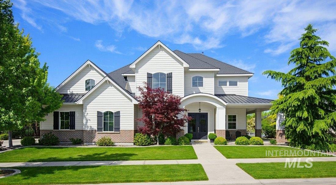 939 South Lake Pointe Way Eagle, ID 83616 - Photo 1 of 50 Two-story residence featuring white siding and brick accents