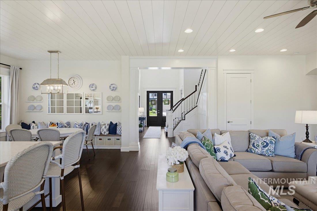 939 South Lake Pointe Way Eagle, ID 83616 - Photo 11 of 50 Open-concept living space featuring dark wood-finish flooring and a white shiplap ceiling