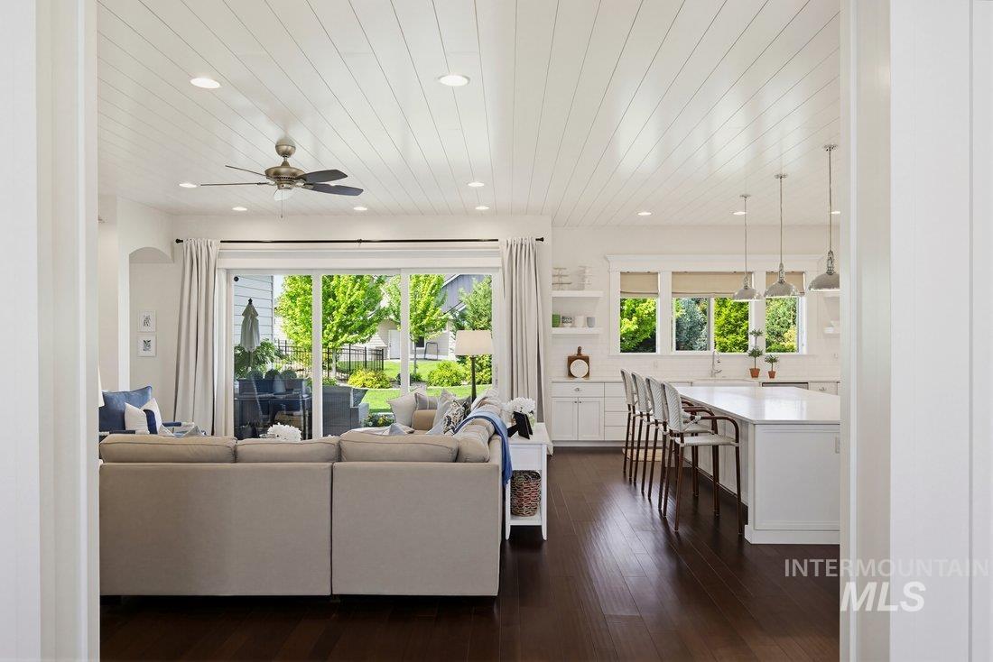 939 South Lake Pointe Way Eagle, ID 83616 - Photo 13 of 50 Expansive living area with dark wood-finish flooring and a white shiplap ceiling