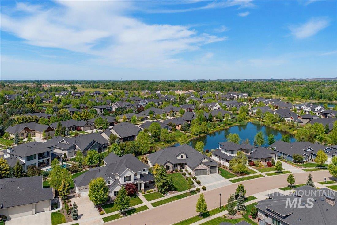 939 South Lake Pointe Way Eagle, ID 83616 - Photo 35 of 50 Aerial perspective showcasing a residential community with numerous homes featuring dark roofing and established landscaping