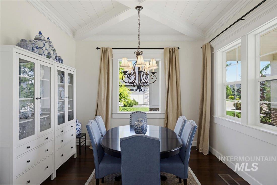 939 South Lake Pointe Way Eagle, ID 83616 - Photo 4 of 50 Dining area featuring a vaulted shiplap ceiling, dark wood-finish flooring, and multiple large windows