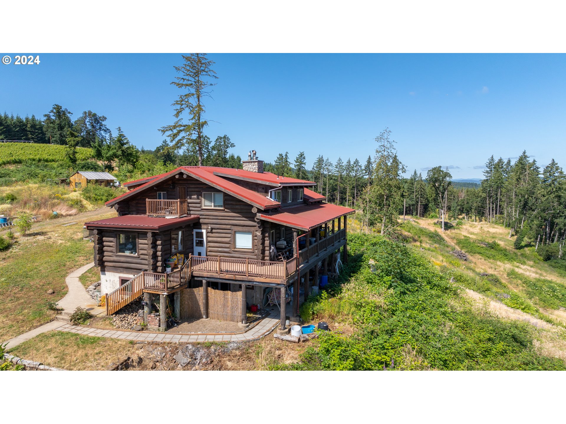 16300 Southeast Walnut Hill Road Amity, OR 97101 - Photo 45 of 48 a balcony with furniture and a garden