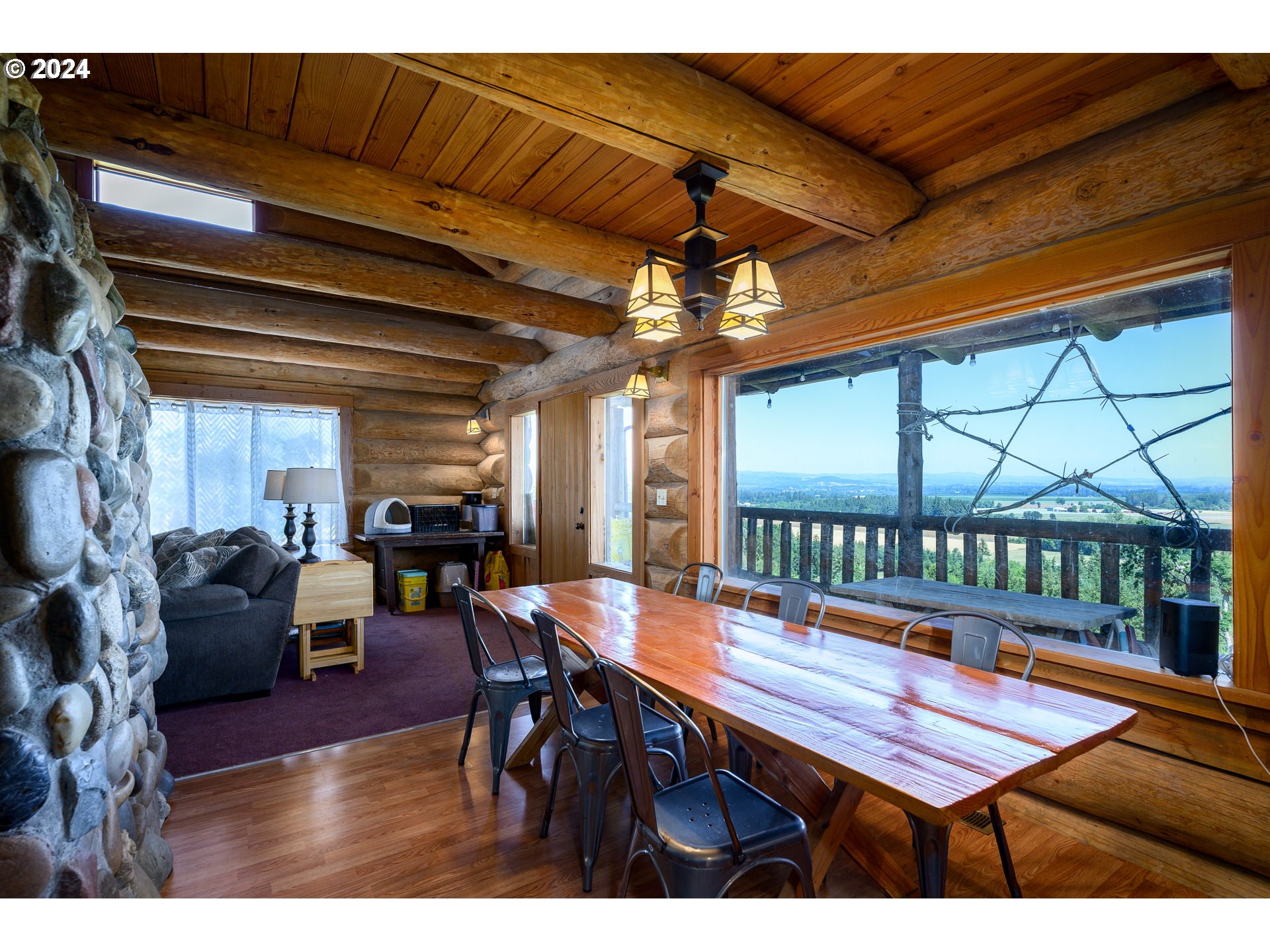 16300 Southeast Walnut Hill Road Amity, OR 97101 - Photo 6 of 48 a view of a dining room with furniture window and wooden floor
