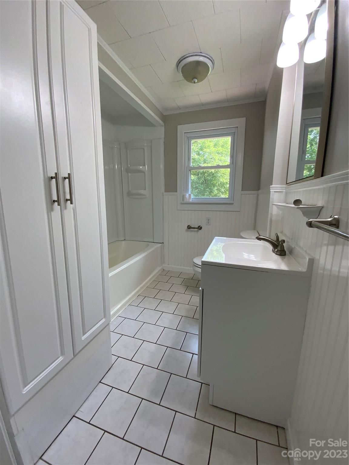 214 Bostic Yard Road Bostic, NC 28018 - Photo 11 of 31 a bathroom with a sink a toilet a mirror and bathtub