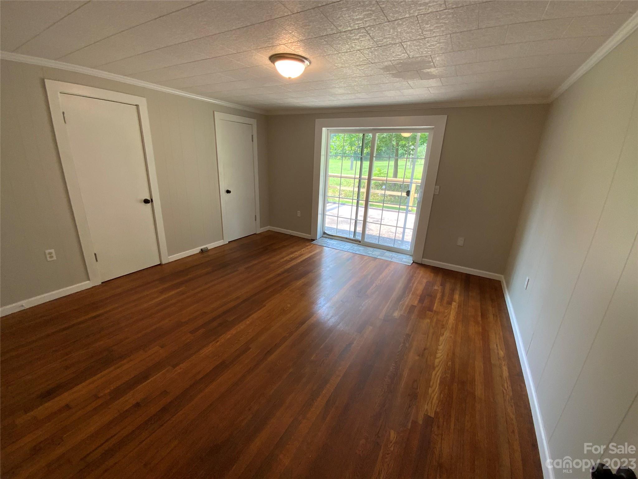 214 Bostic Yard Road Bostic, NC 28018 - Photo 13 of 31 a view of an empty room with wooden floor and a window