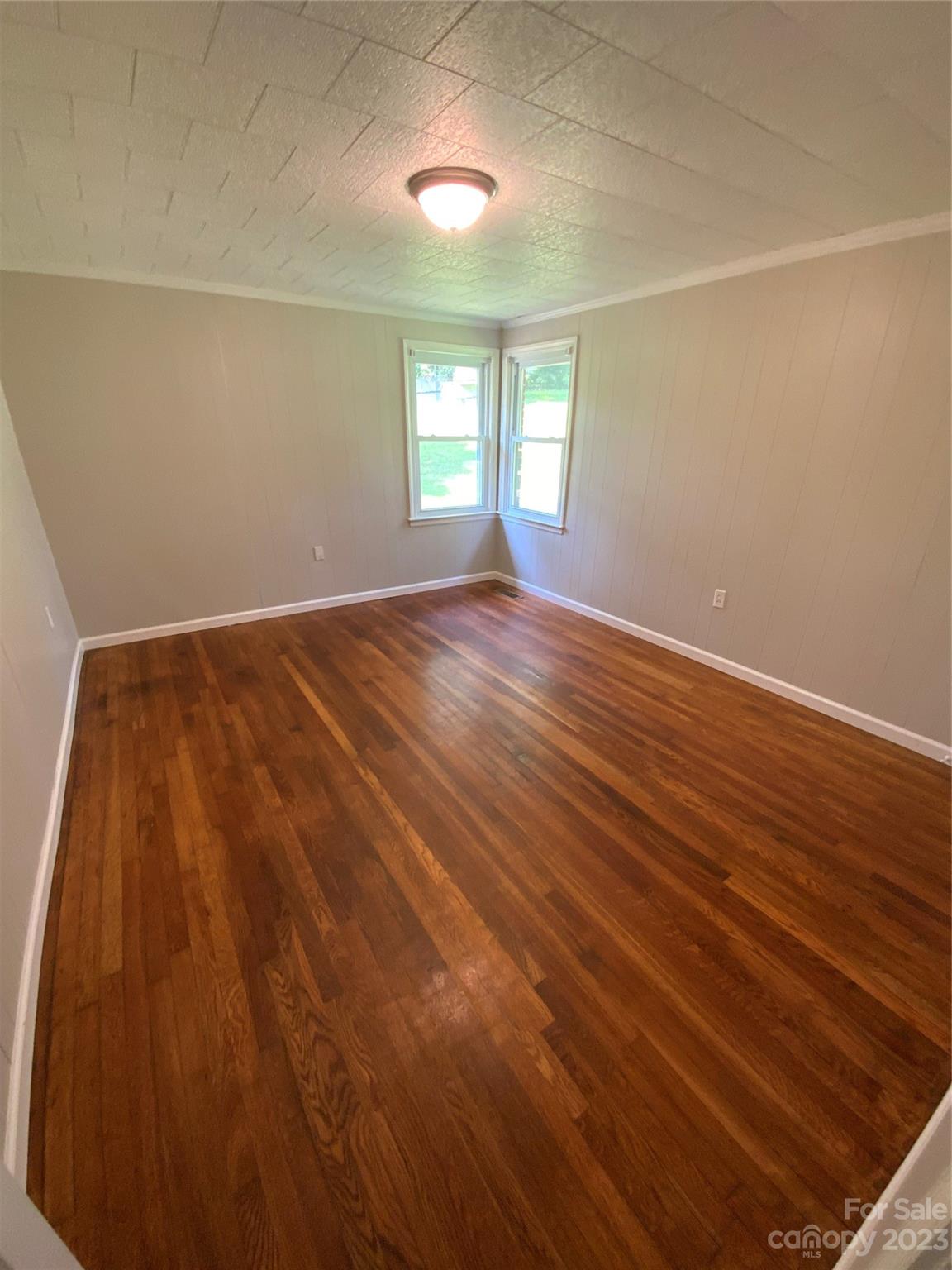 214 Bostic Yard Road Bostic, NC 28018 - Photo 14 of 31 an empty room with wooden floor and windows