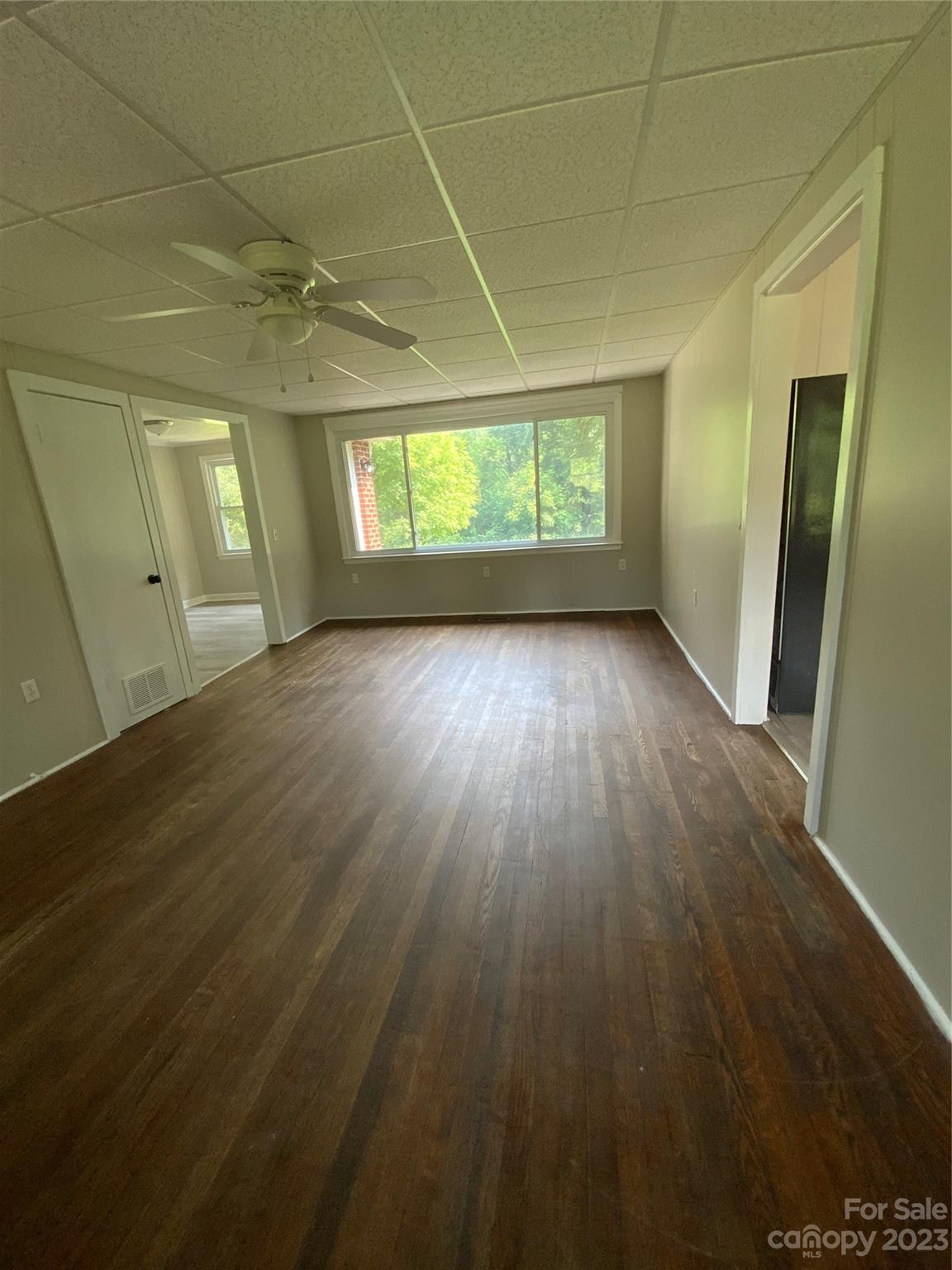 214 Bostic Yard Road Bostic, NC 28018 - Photo 19 of 31 an empty room with wooden floor and windows