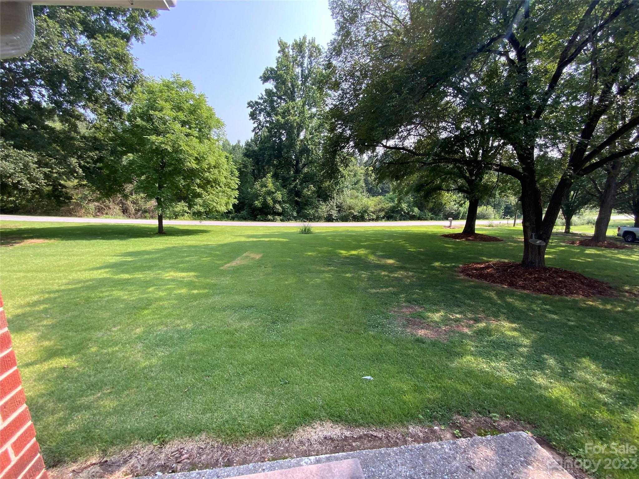 214 Bostic Yard Road Bostic, NC 28018 - Photo 23 of 31 a grassy field with trees in the background