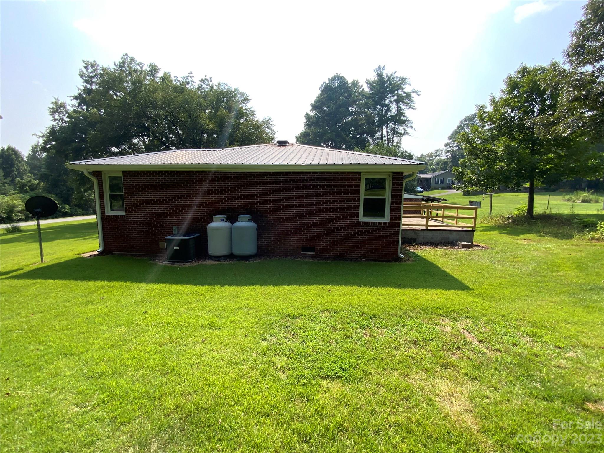 214 Bostic Yard Road Bostic, NC 28018 - Photo 25 of 31 a view of a backyard with a garden and plants