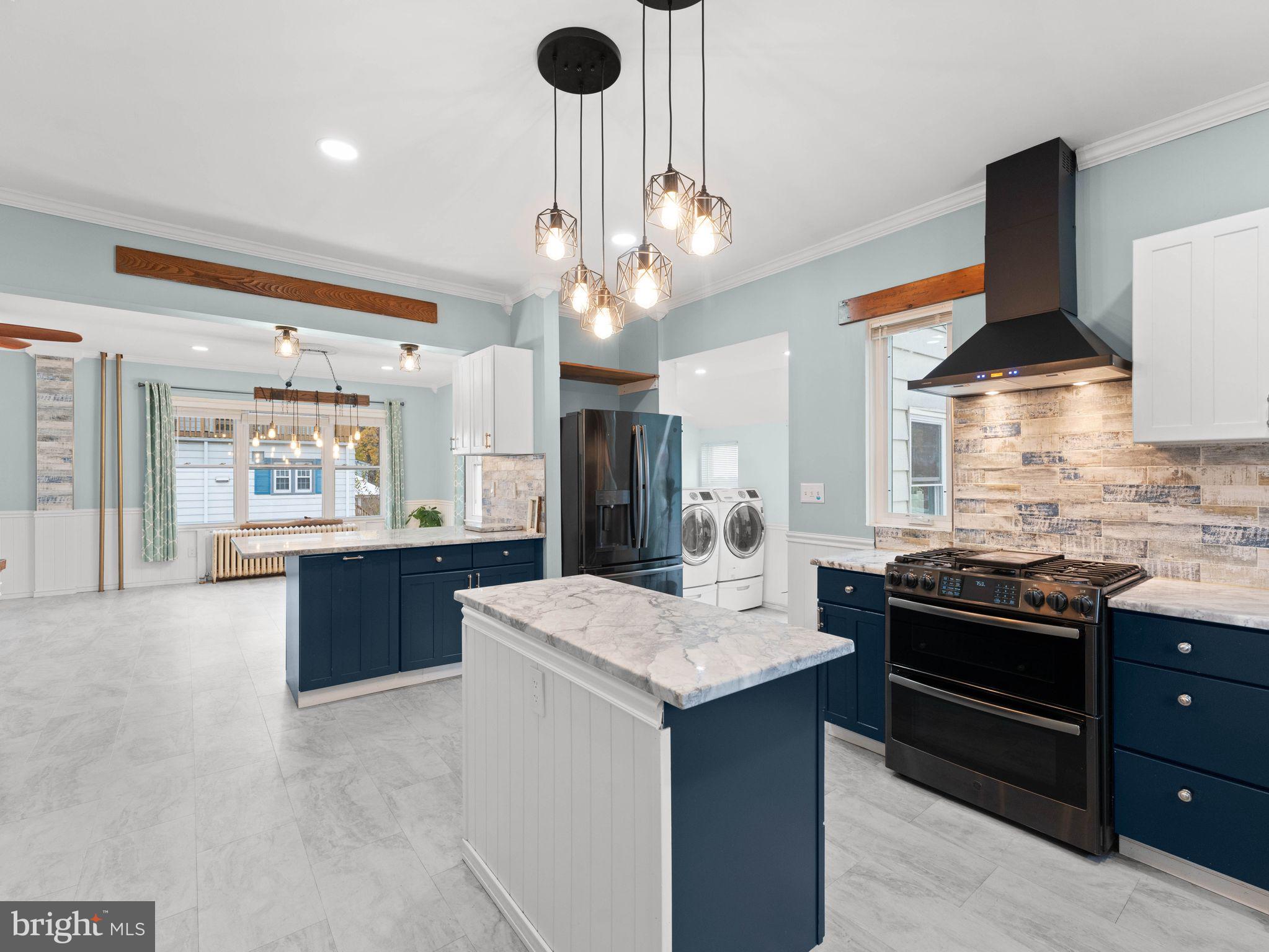 400 2nd Street Swedesboro, NJ 08085 - Photo 11 of 33 a kitchen with stainless steel appliances kitchen island granite countertop a sink and a stove