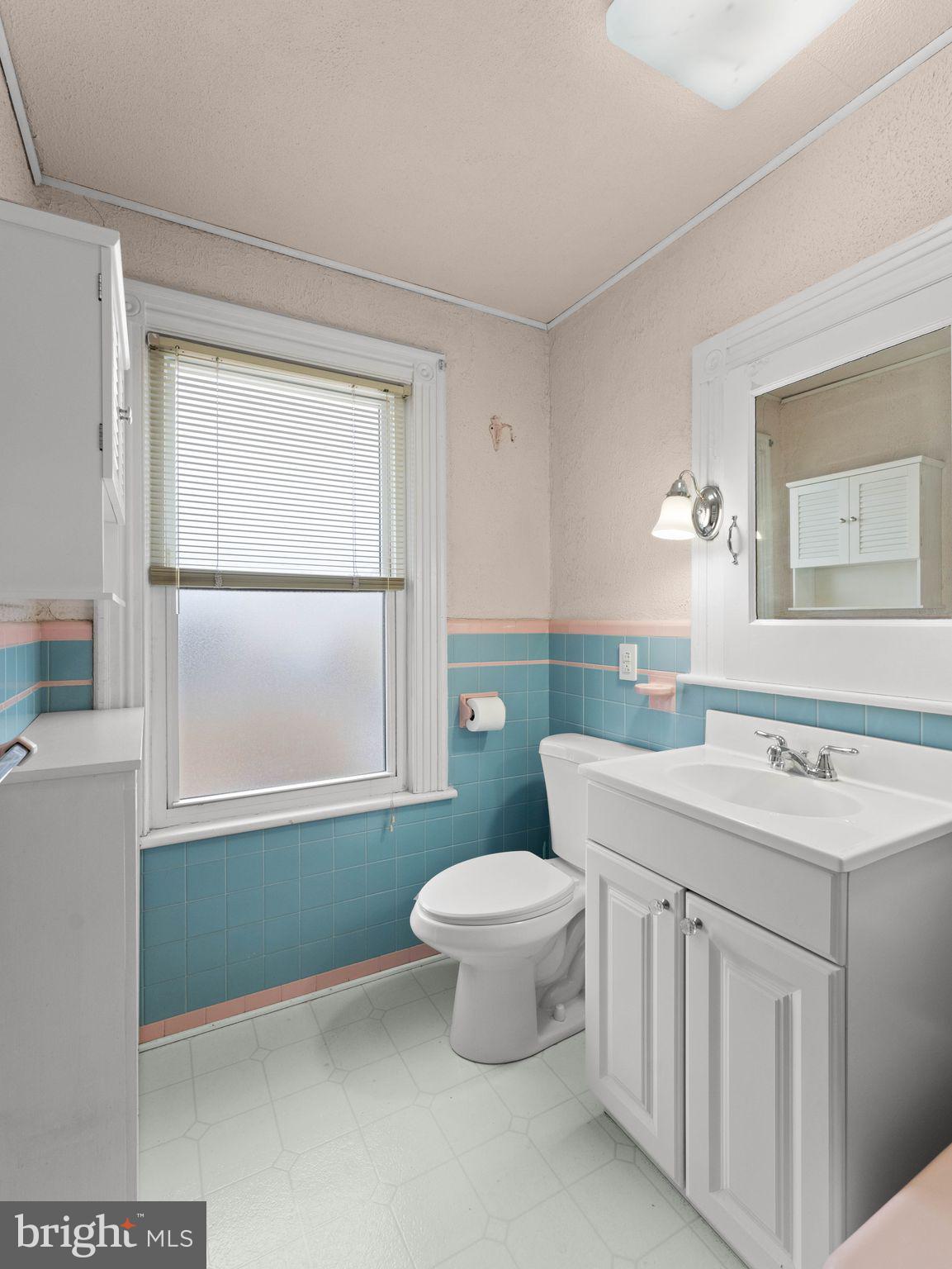 400 2nd Street Swedesboro, NJ 08085 - Photo 23 of 33 a bathroom with a sink toilet and window