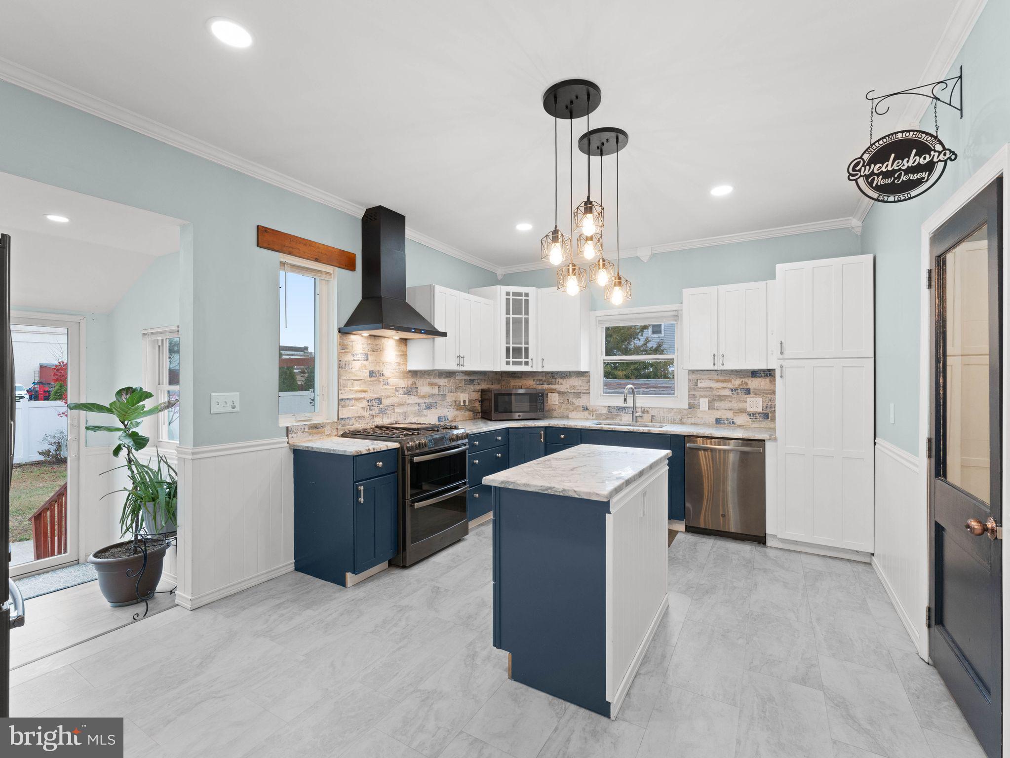 400 2nd Street Swedesboro, NJ 08085 - Photo 9 of 33 a kitchen with a refrigerator and a sink