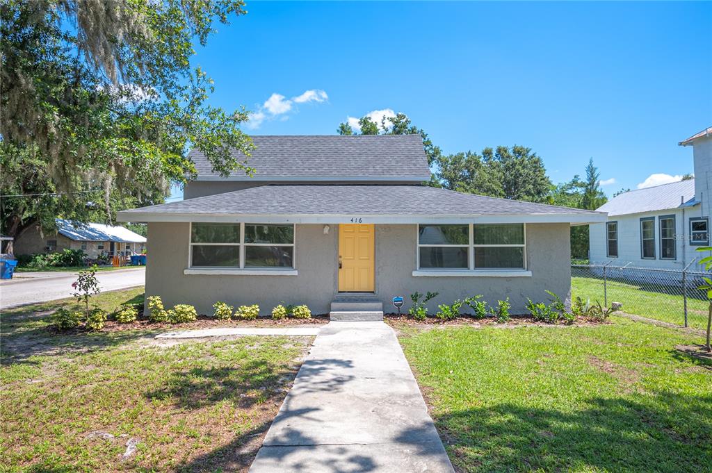 416 West Broadway Street Fort Meade, FL 33841 - Photo 1 of 1 a front view of a house with a yard