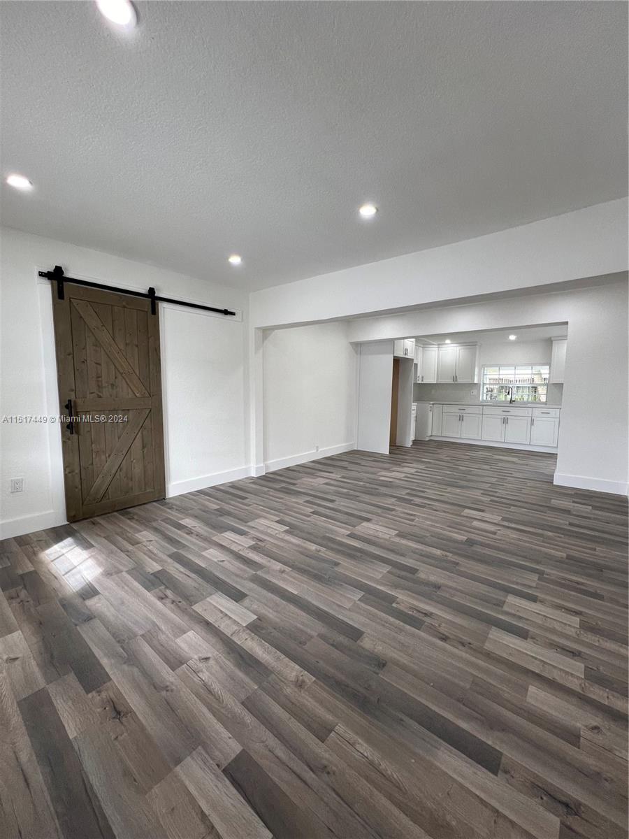 375 West 37th Street Hialeah, FL 33012 - Photo 11 of 19 a view of empty room with wooden floor