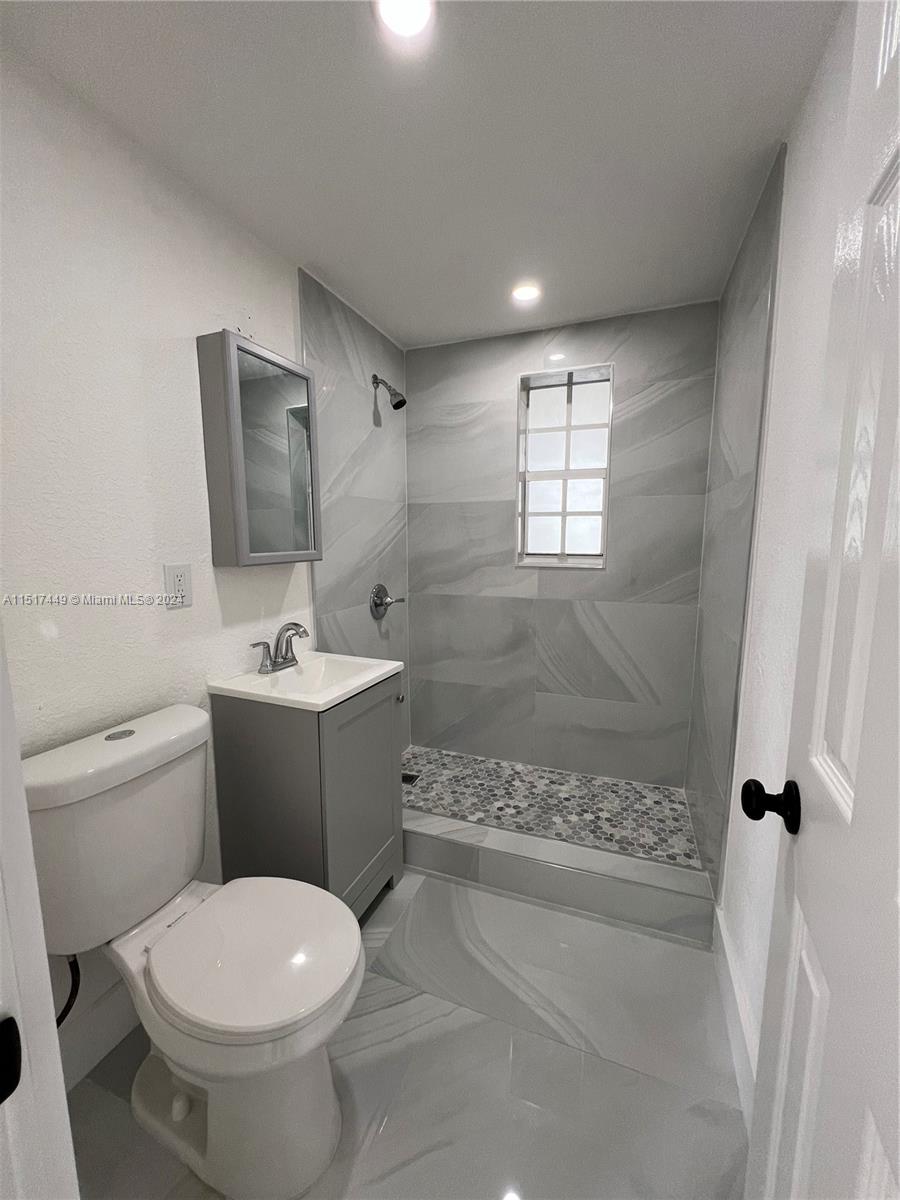375 West 37th Street Hialeah, FL 33012 - Photo 14 of 19 a bathroom with a toilet sink and shower