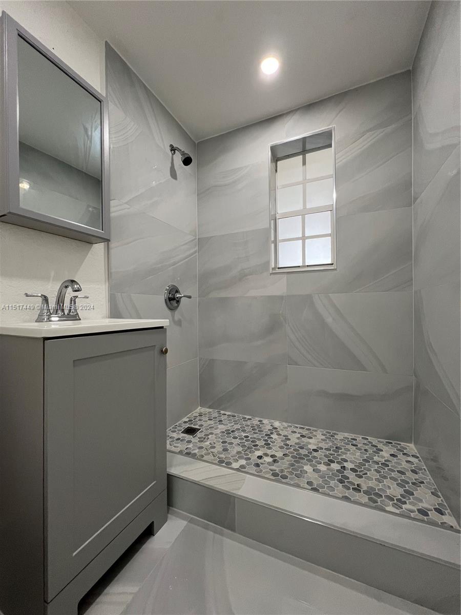 375 West 37th Street Hialeah, FL 33012 - Photo 15 of 19 a bathroom with a sink a toilet and shower