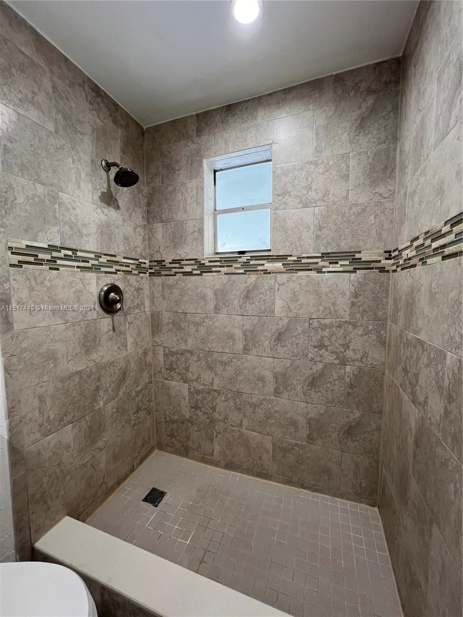 375 West 37th Street Hialeah, FL 33012 - Photo 19 of 19 a bathroom with a shower and toilet