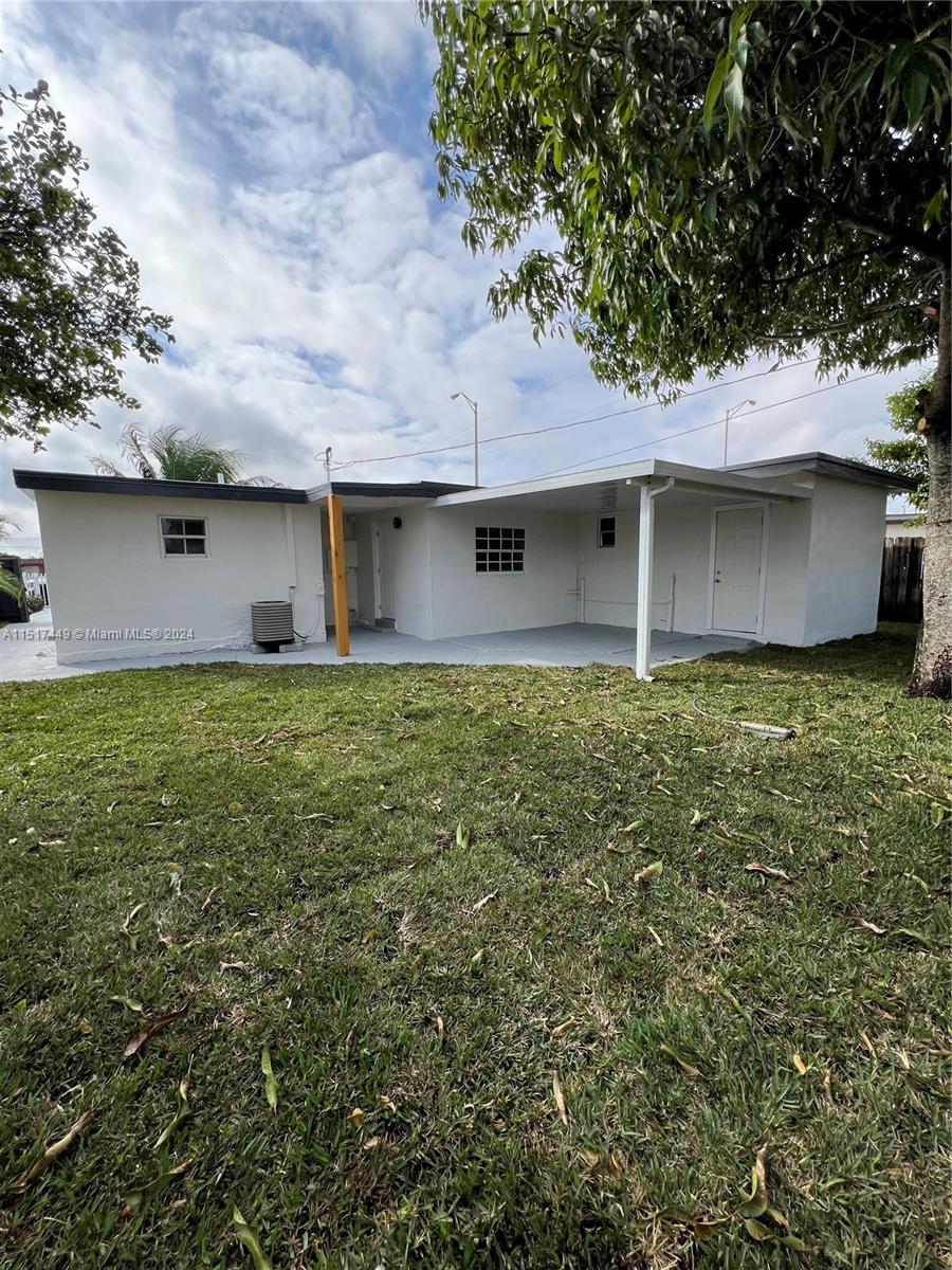 375 West 37th Street Hialeah, FL 33012 - Photo 6 of 19 a house view with a garden space