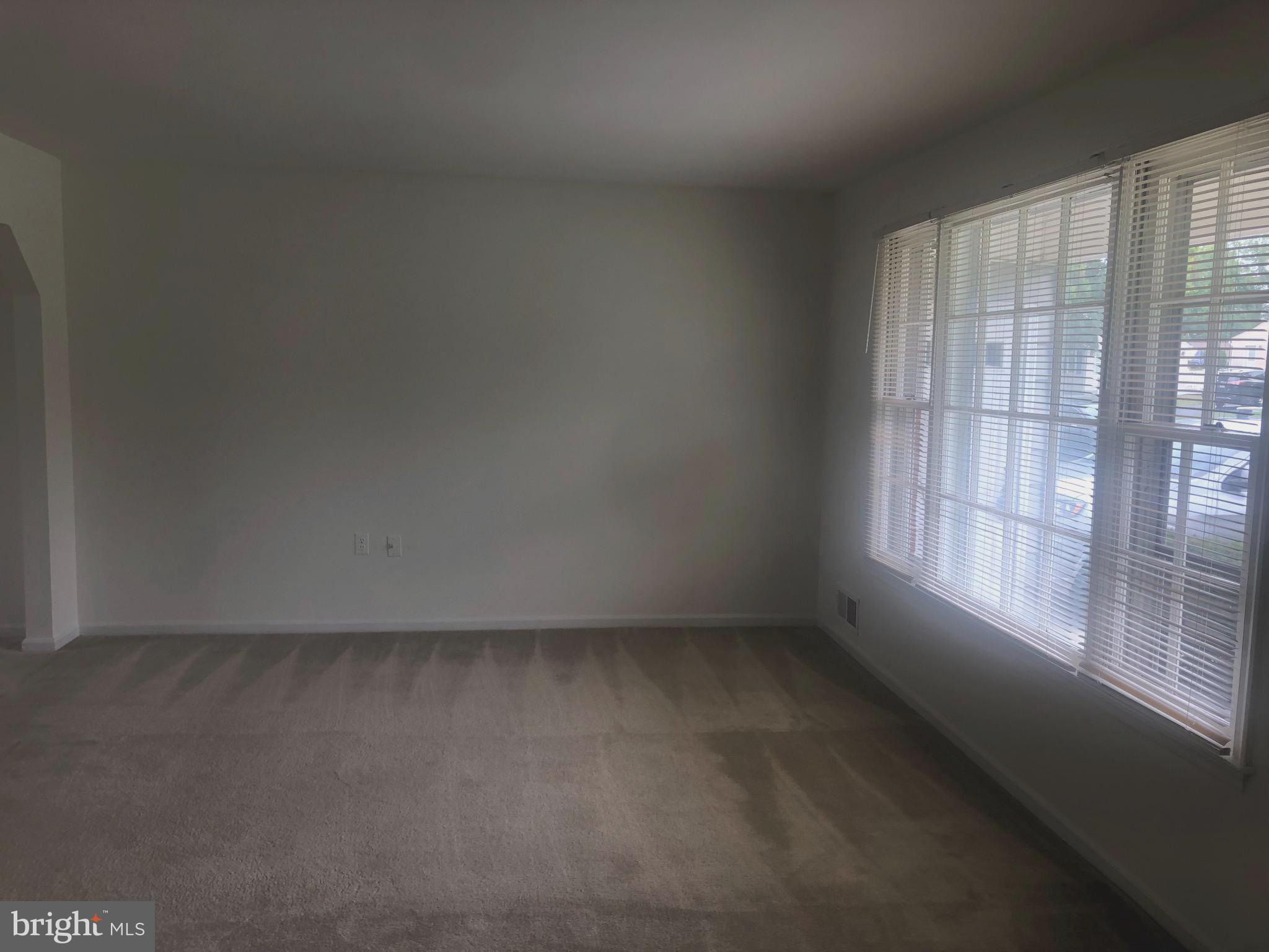 17600 Shamrock Drive Olney, MD 20832 - Photo 2 of 11 an empty room with a window
