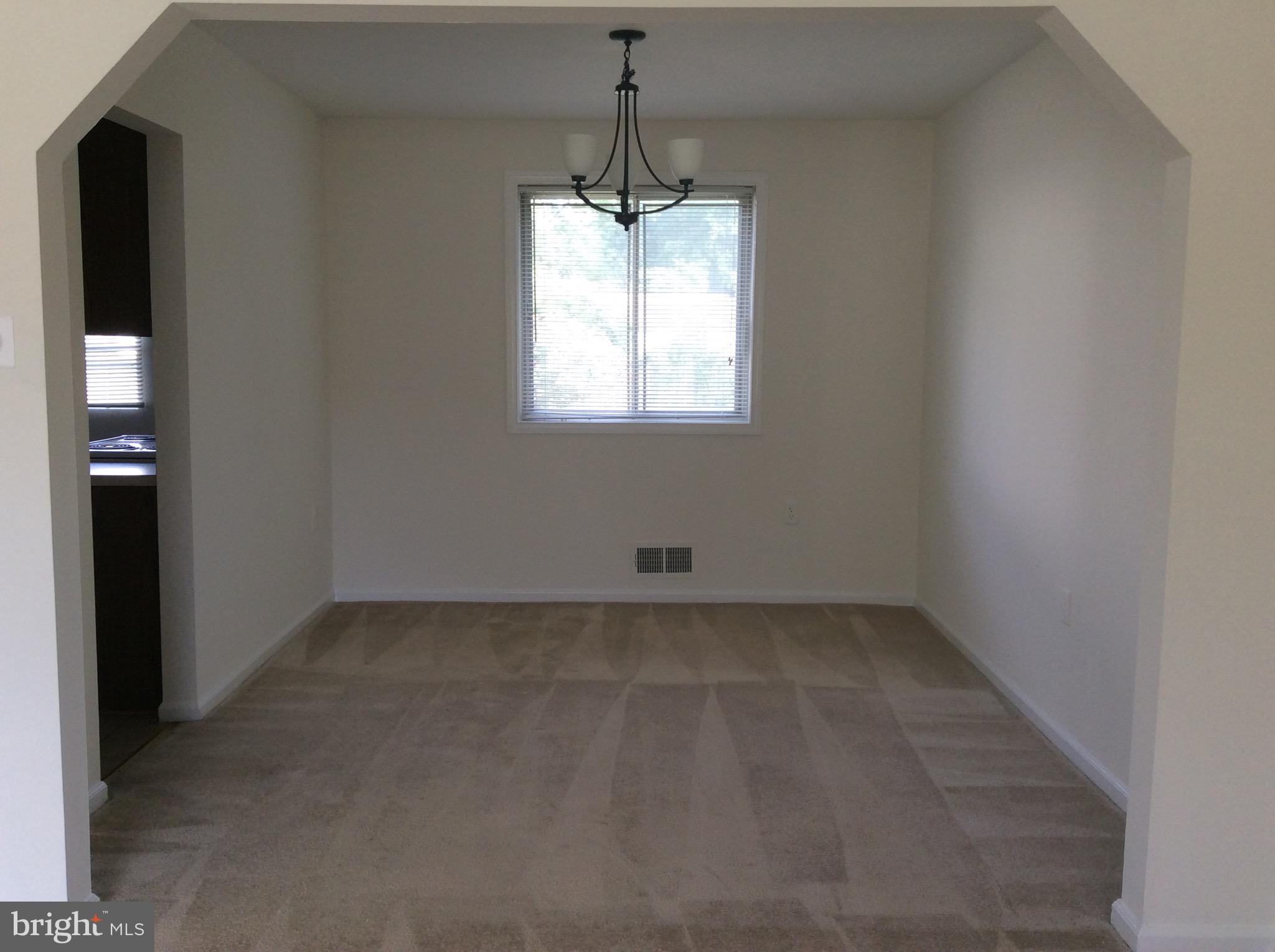 17600 Shamrock Drive Olney, MD 20832 - Photo 4 of 11 an empty room that has a window