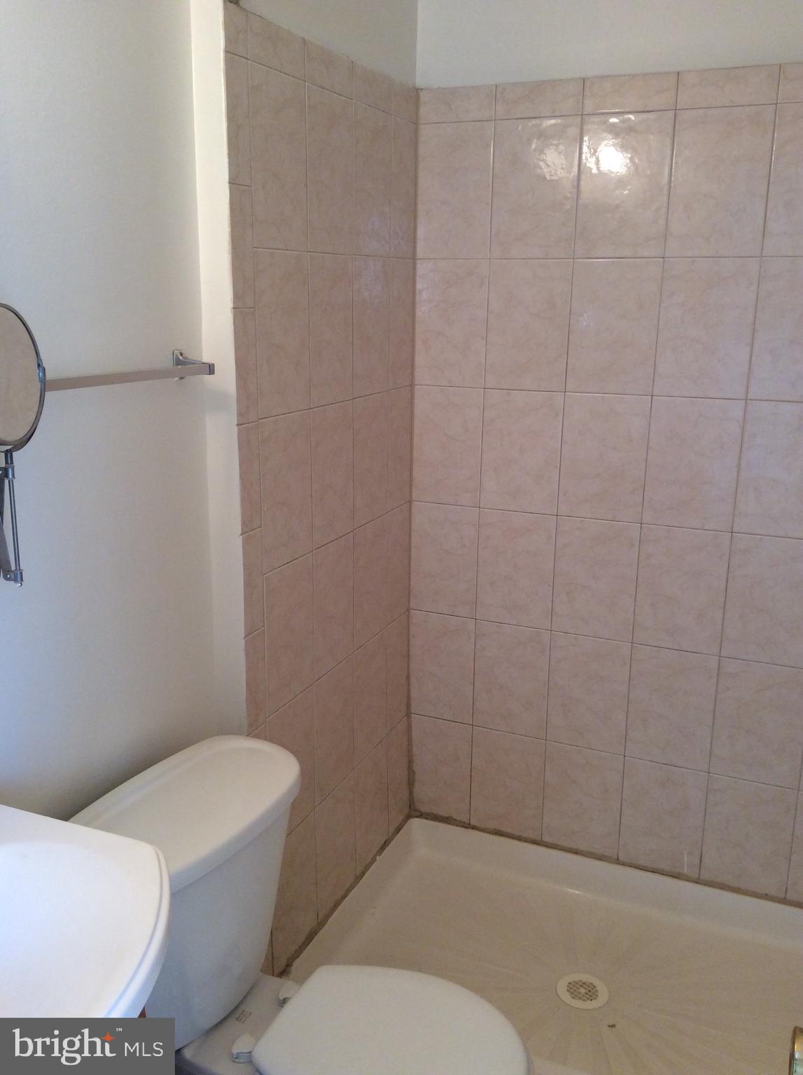 17600 Shamrock Drive Olney, MD 20832 - Photo 9 of 11 a bathroom with a toilet and a shower