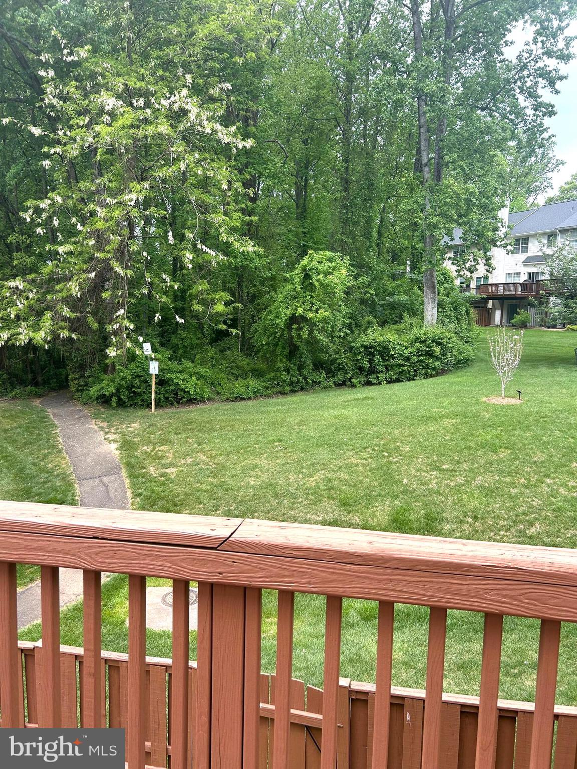 4658 Buckhorn Ridge Fairfax, VA 22030 - Photo 34 of 35 a view of a wooden deck and a yard