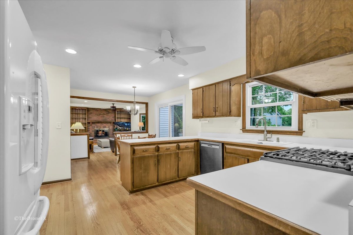 659 Brighton Drive Wheaton, IL 60189 - Photo 11 of 25 a kitchen with stainless steel appliances granite countertop a stove and a sink