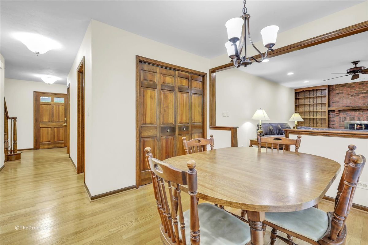 659 Brighton Drive Wheaton, IL 60189 - Photo 13 of 25 a view of a dining room with furniture and wooden floor
