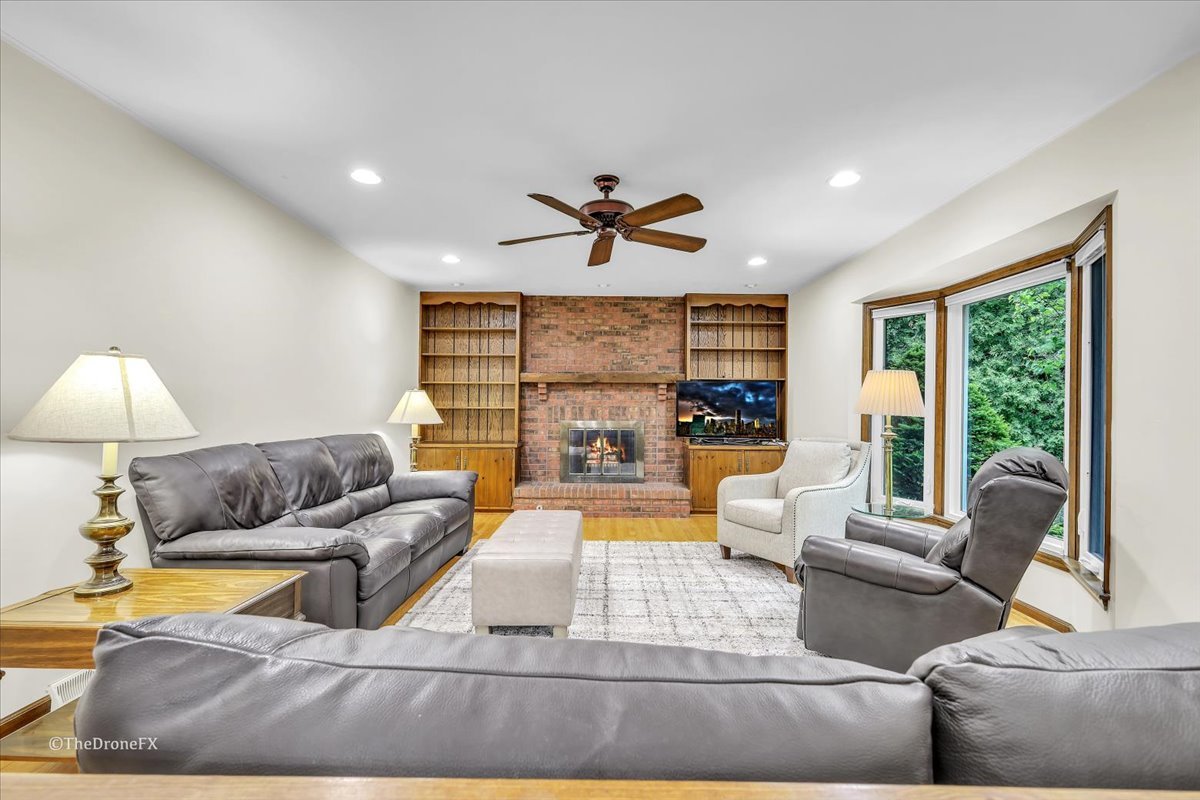 659 Brighton Drive Wheaton, IL 60189 - Photo 14 of 25 a living room with furniture and a large window