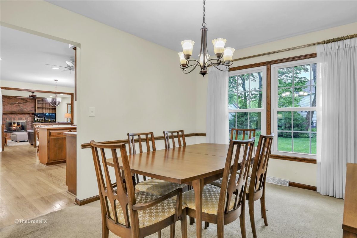 659 Brighton Drive Wheaton, IL 60189 - Photo 16 of 25 a view of a dining room with furniture window and outside view