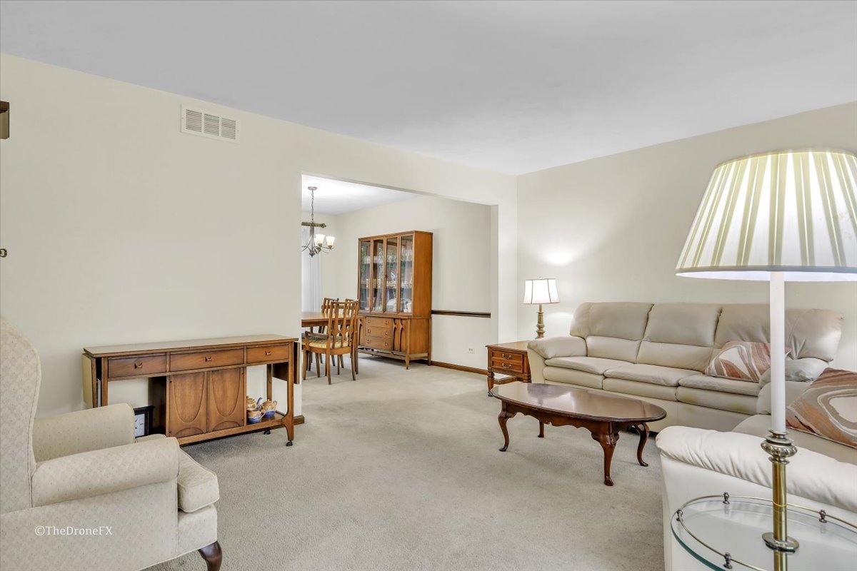659 Brighton Drive Wheaton, IL 60189 - Photo 19 of 25 a living room with furniture and a large window