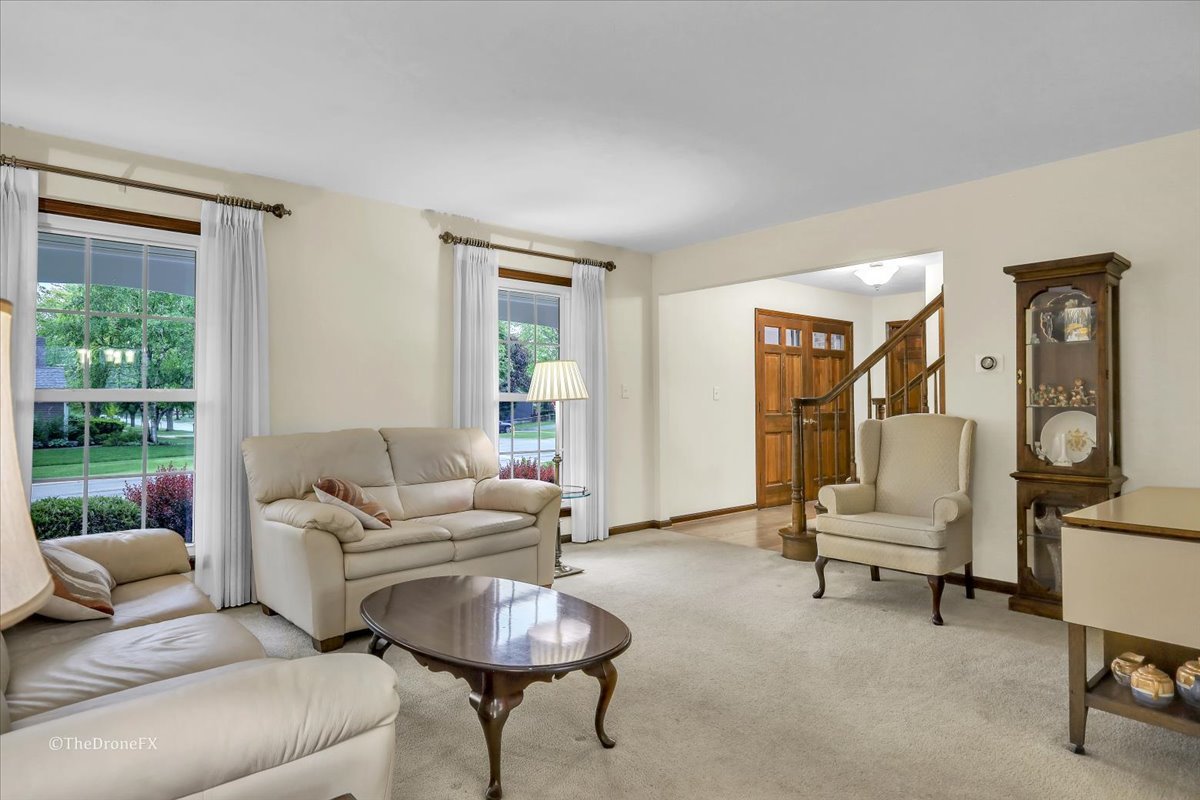 659 Brighton Drive Wheaton, IL 60189 - Photo 20 of 25 a living room with furniture and a large window